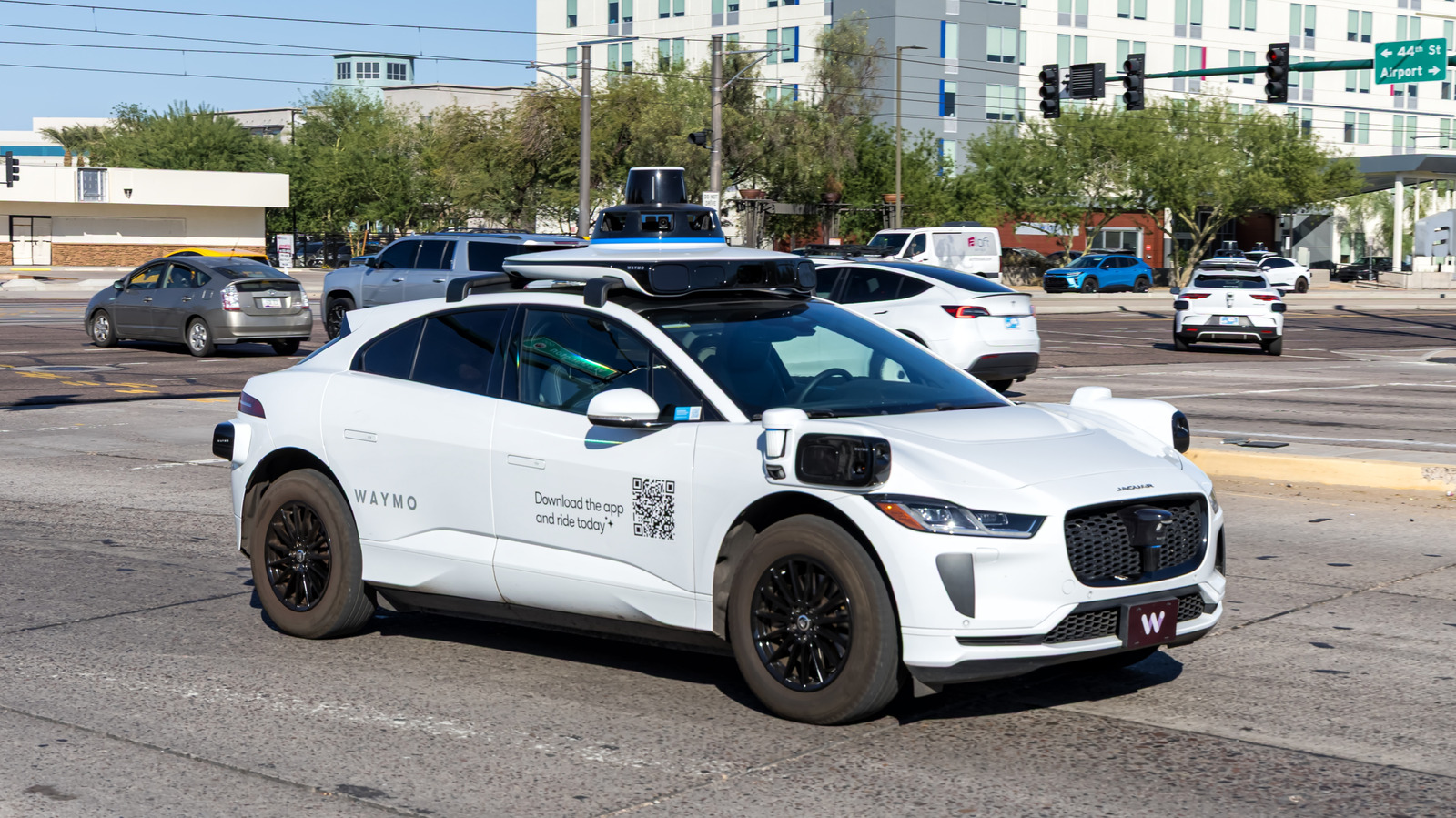 A Waymo driverless vehicle stopped in between train tracks and a railroad stop arm while a train was incoming in Texas on March 7, 2026. It had no passengers.