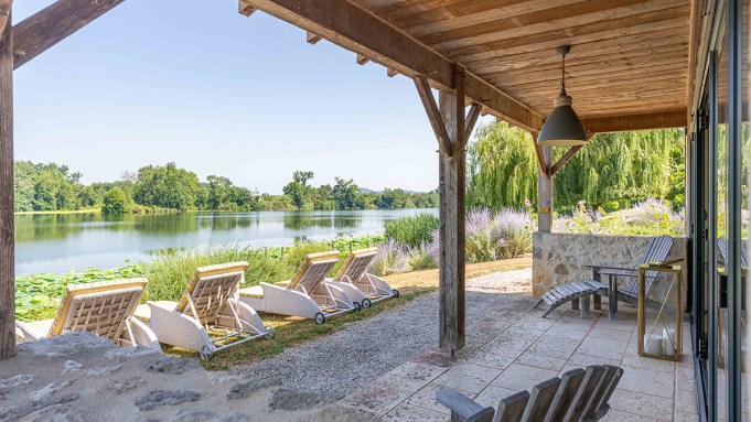 Set in Lot-et-Garonne, the restored estate spans five acres with six bedrooms, a swimming pool, tennis court, and private pontoon on the River Lot.